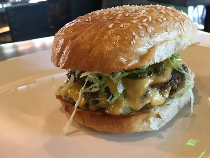 Image: The Standard Burger at Wheelhouse, $14, has two beef patties, special sauce, lettuce and a pickle.