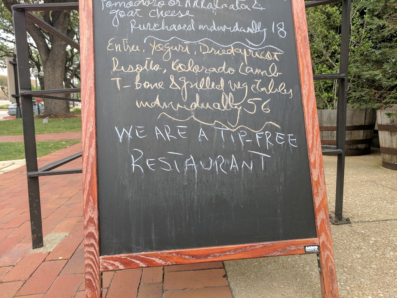 The sign in front of Canary by Gorji announces its no-tip policy.