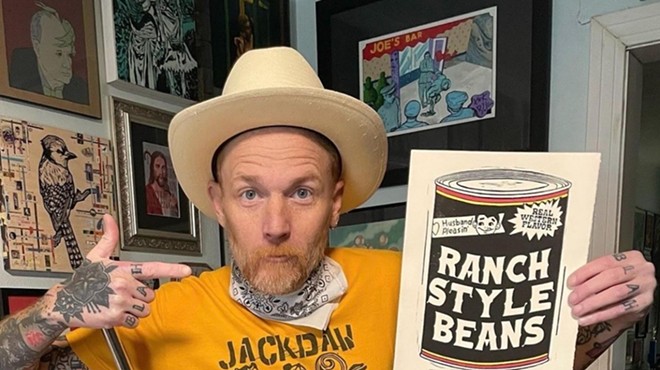 Fort Worth artist Jack Daw poses with a drawing of Ranch Style beans. He draws Texas scenes like no other: with humor and wit.