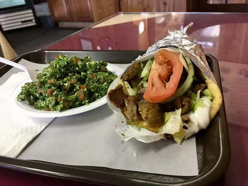 Image: A simple, unadorned lamb and beef gyro and a must-have side of Fattoush salad are less than 10 bucks.
