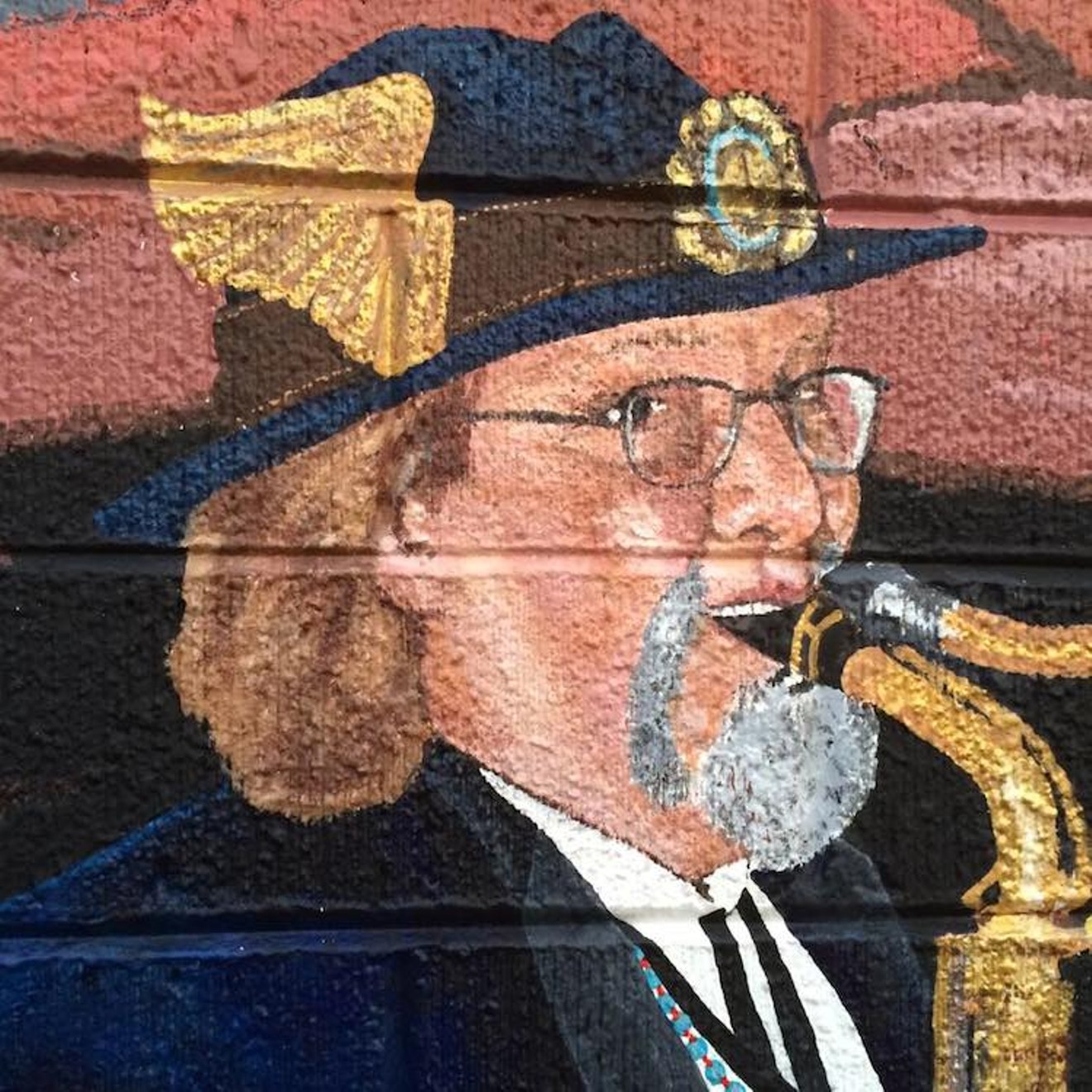 A mural of Jeffrey Barnes is painted outside Juicy Pig Barbecue in Denton.
