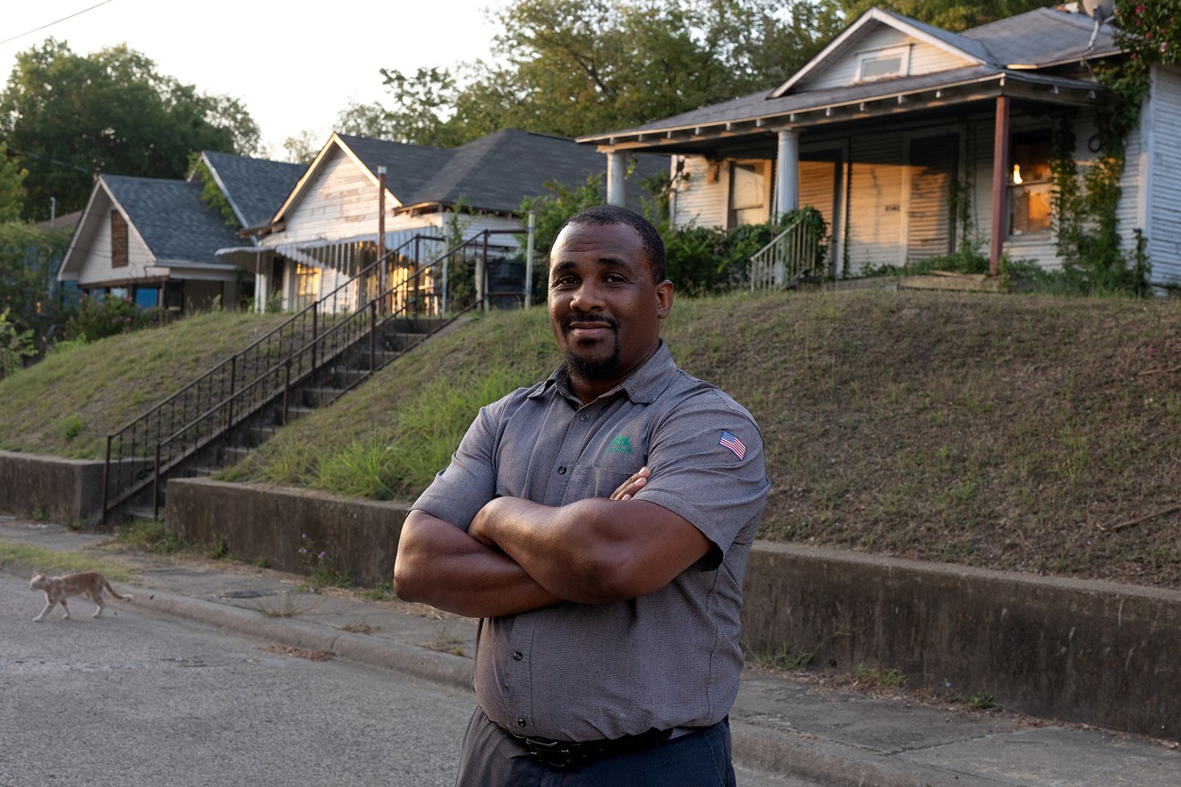 Larry Johnson in front of a home he is restoring in the Tenth Street neighborhood.