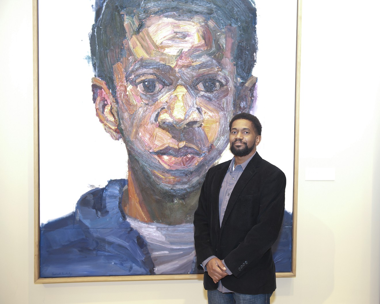 Sedrick Huckaby at the Meadows Museum with his painting “Rising, Sonny, Son.”