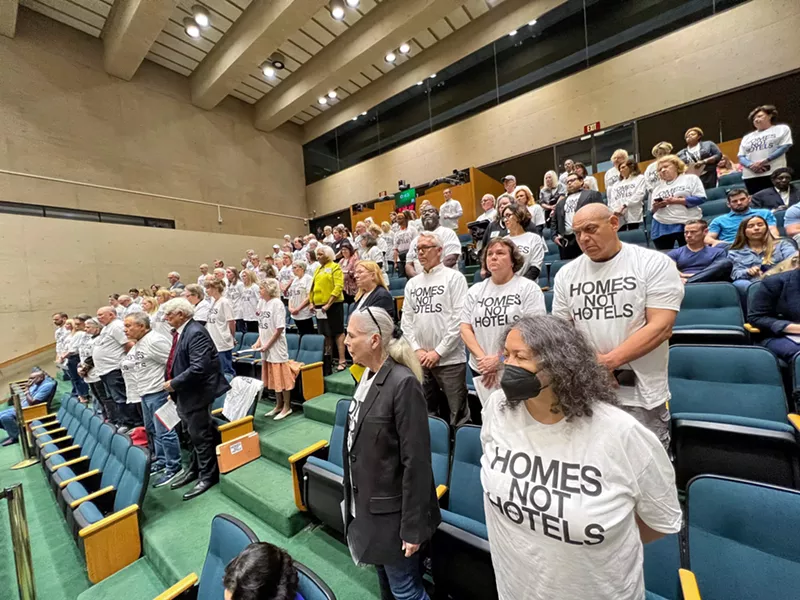 Image: Community members who spoke against short-term rentals during a late-night city council meeting in 2023 wore "Homes Not Hotels" T-shirts.