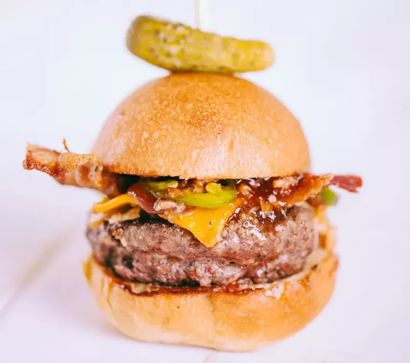 Image: Cheddar, bacon, homemade barbecue sauce, grilled jalapeños and crispy onion strings — two for $9 at Easy Slider in Deep Ellum.