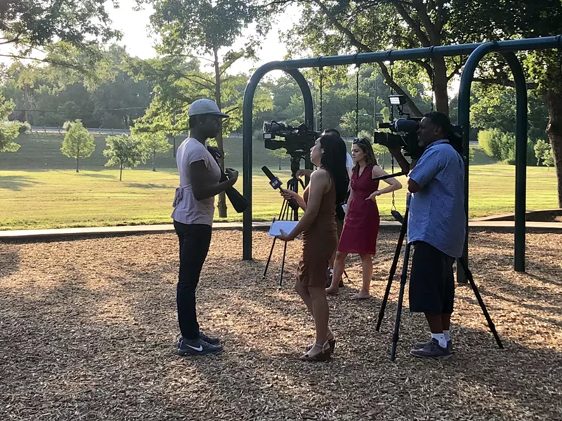 Image: Shannon Walker, a friend of Nicole Hall's, talks to a reporter before the vigil for Hall, who was found dead May 12.