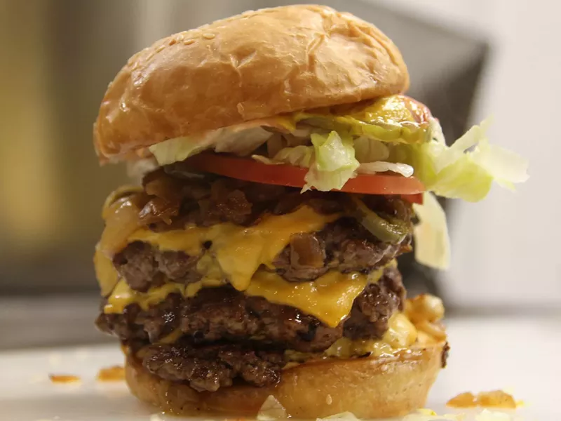 Image: A triple burger is made-to-order and $7.49 ($8.99 with cheese) at Sky Rocket.