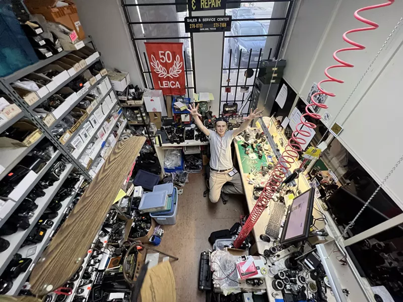 Image: Tristan Talkington shows off Garland Camera's extensive parts wall.