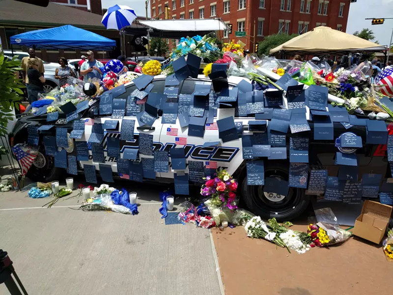 Image: One of the impromptu memorials in front of Jack Evans Police headquarters on July 9, 2016.