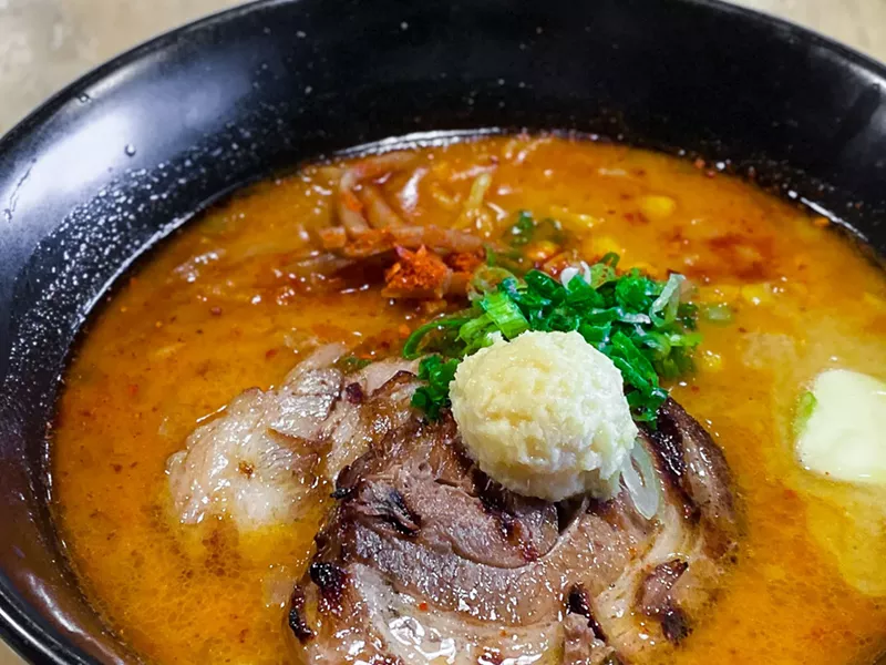 Image: Special spicy miso ramen is served with two thick slices of pork belly.