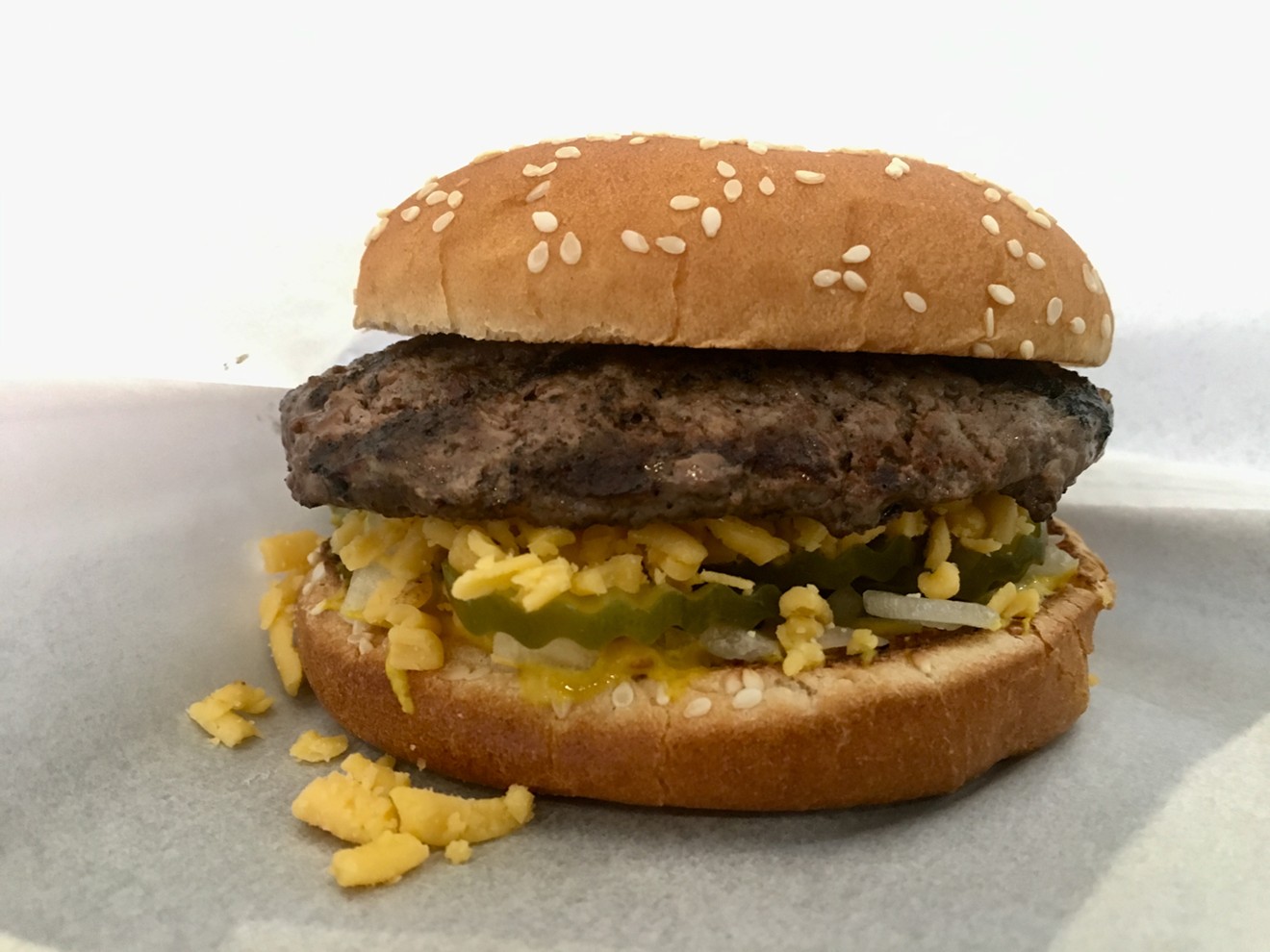 Shredded cheese, loaded over pickles on the bottom bun, melts under a well done choice Angus beef patty. ($4.75)