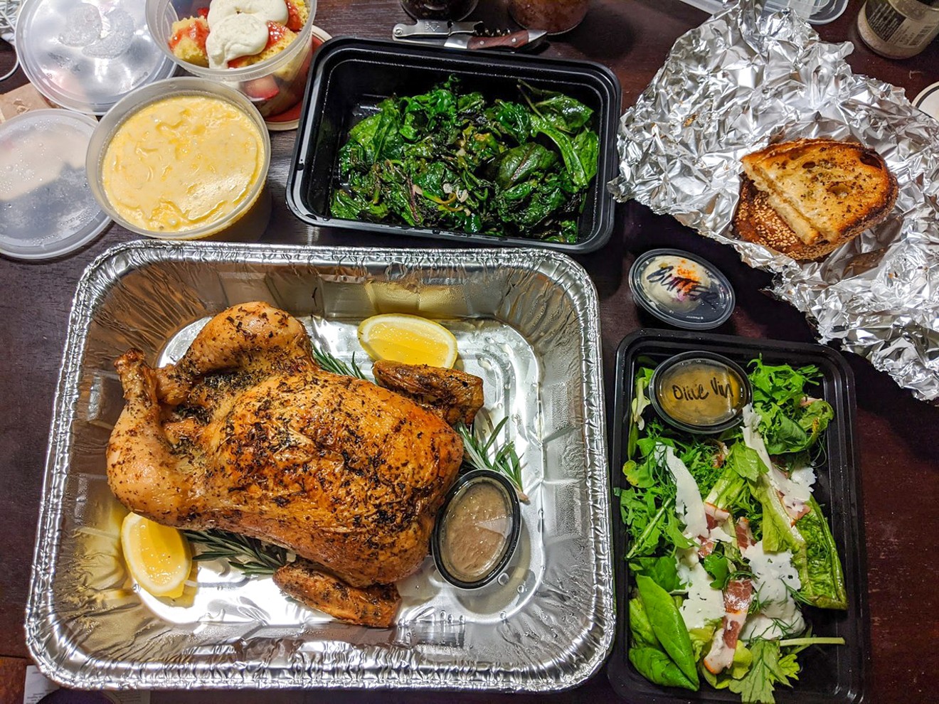 Homewood's $80 roasted chicken dinner for two with wilted greens, salad, garlic sourdough, cheesy grits and strawberry shortcake.