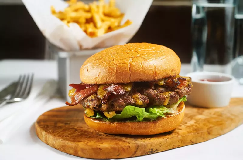 Image: The toppings change every day for the cheeseburger at Parigi. It's $14 with perfect french fries.