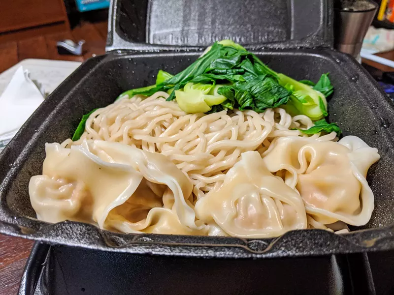 Image: Take home your serving of pork wontons and noodles, then pour the spicy chili oil (packed separately) over the top to complete it.