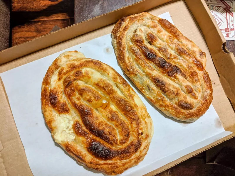 Image: These are pies here: a flaky loaf of bread, formed and coiled into a spiral before baking.