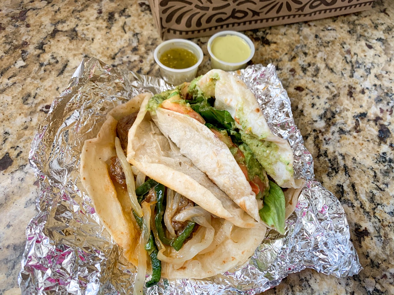 The Frontera fundido sirloin and Heather tacos from Tacodeli in Dallas — looking less pretty after transport than they would in the restaurant normally.