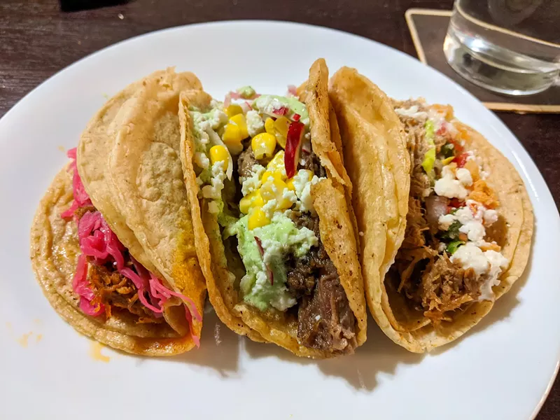 Image: Taco y Vino to go with cochinita pibil (left) brisket and carnitas