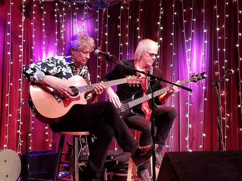 Image: Guitarist Jim "Kimo" West (left) and bass player Stephen Jay perform at the Red Light Cafe in Atlanta for their Parallel Universe Tour, which comes to Poor David's Pub in Dallas on Friday.