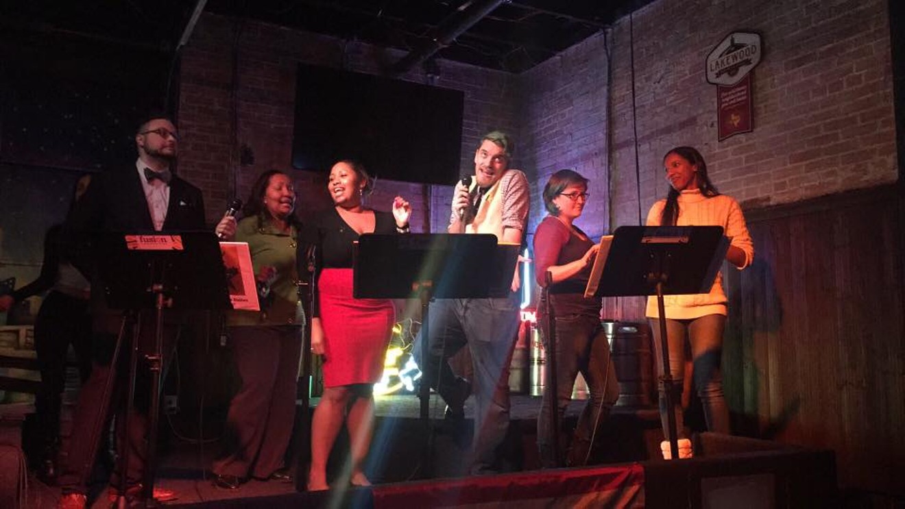 Local Hamilton fans act out their favorite musical at a singalong at Mac’s Southside attended by nearly 100 people.