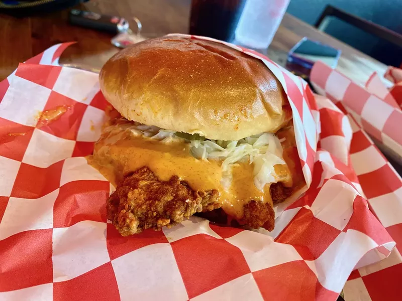Image: A substantial brioche bun holds this hot mess together nicely.