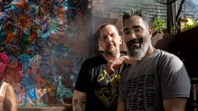 Two guys posing for a photo