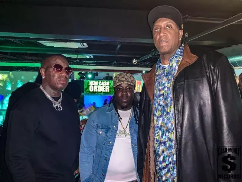 Image: Fat Yunginn (center) with major label executives Brian “Birdman” (left) and Ronald “Slim” Williams