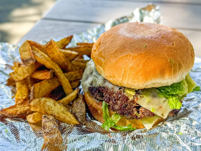 Image: John's Backyard Grill Mexican burger: pepper jack, pico de gallo, avocado, lettuce, tomato, mayo and jalapeño.