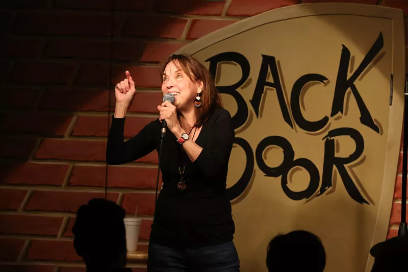 Image: Comedian and Backdoor Comedy Club co-owner Linda Stogner performs stand-up at her Richardson club, one of North Texas' longest operating comedy theaters.