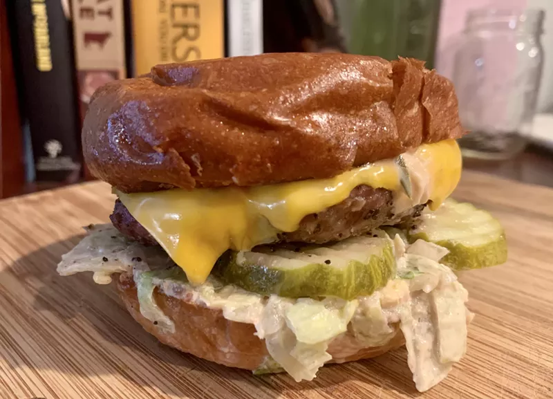 Image: The Kahuna burger at the Peak Inn has a slaw, under good crinkle-cut pickles, tossed in a house-made Thousand Island for $7.