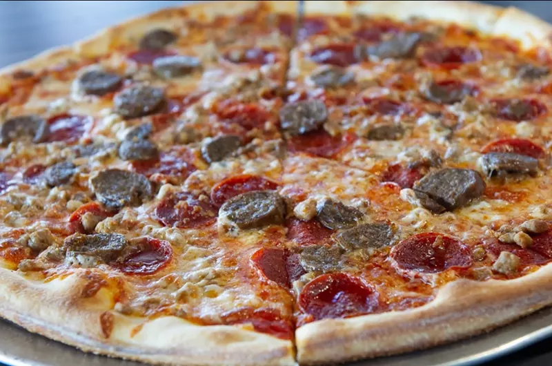 Image: People experiencing homelessness can regularly receive food and water at In Fretta Urban Pizza Bar in Plano.