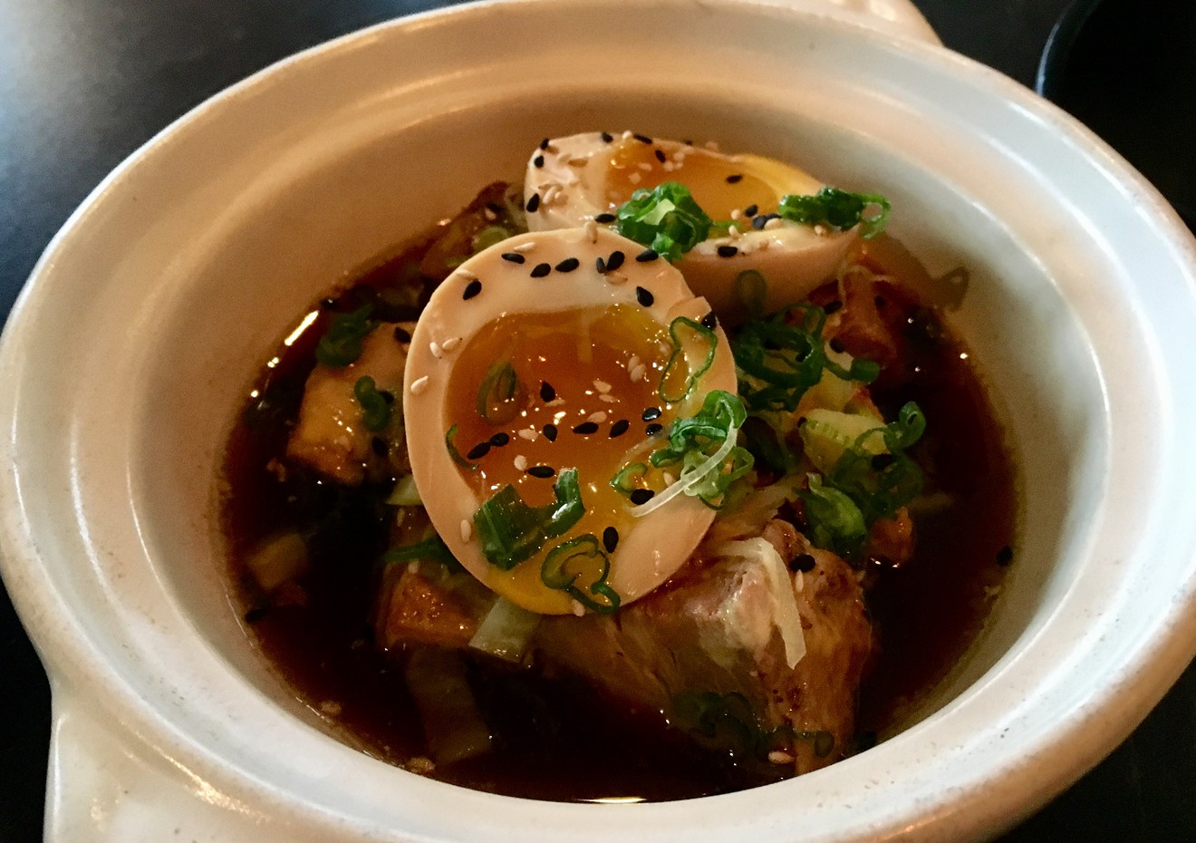 The stunning buta kakuni bowl, with soy-ginger-braised pork belly, pickled ginger, mustard greens and a soft-boiled egg.
