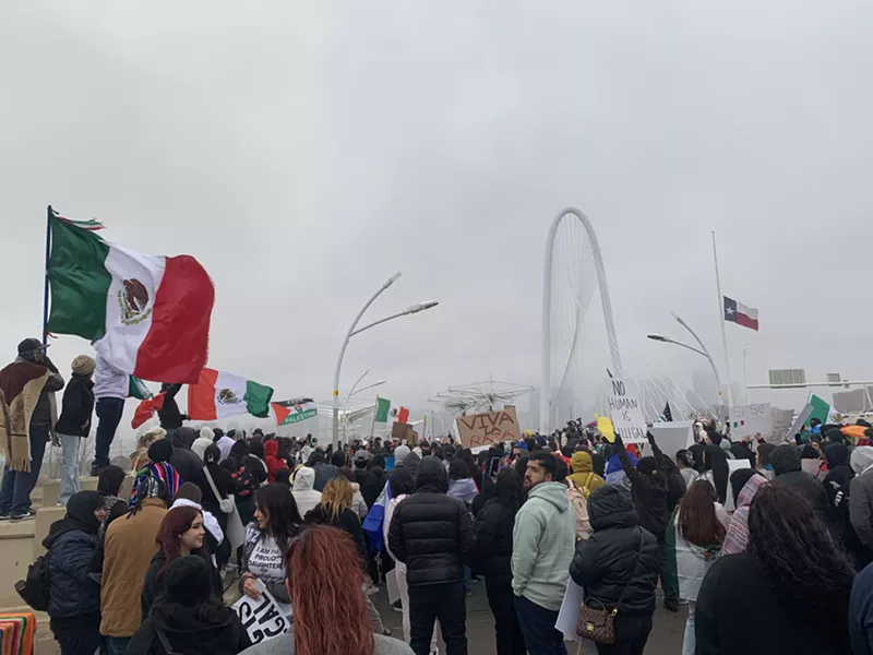 Image: Protesters stayed out Sunday evening despite frigid temperatures.