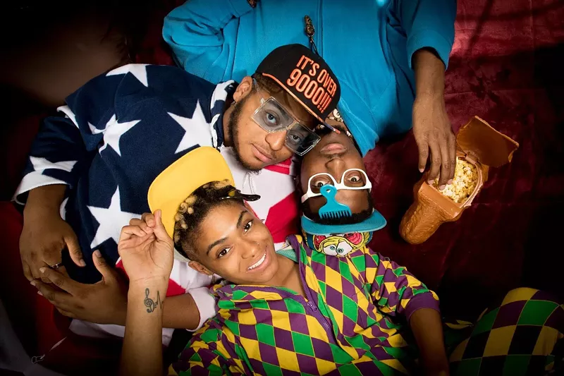 Image: That's Kwinton Gray in the American flag onesie, KJ in the blue onesie, and Kierra with the yellow hat.