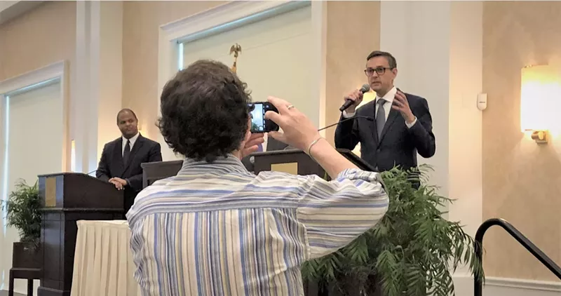 Image: In a debate at the Belo Mansion on Monday, mayoral candidate Scott Griggs, right, did not respond to personal barbs from opponent Eric Johnson, left.