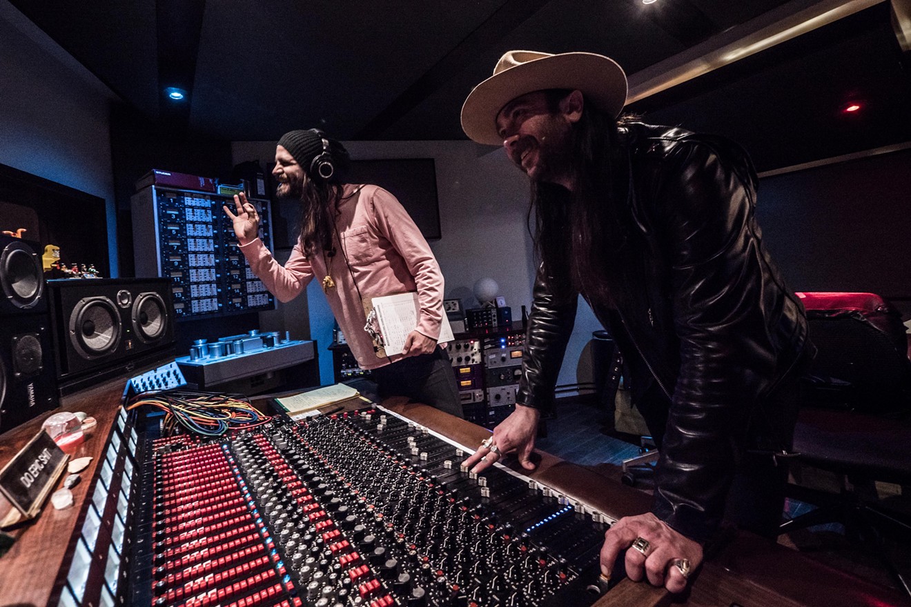 Beau Bedford (left) and Jeff Saenz run the sound board during a recording at Modern Electric in Dallas.