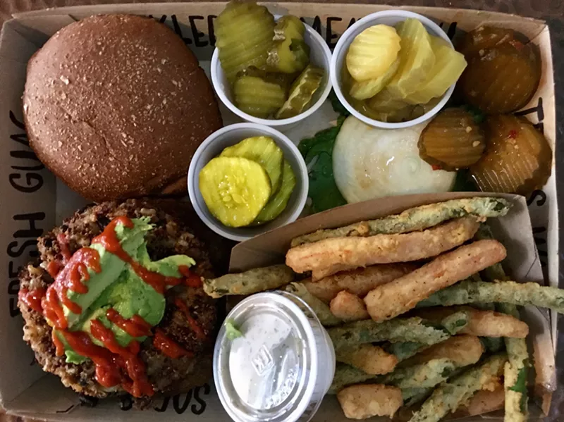 Image: A burger and fried green beans platter from Twisted Root Burger Co. includes essential Hunn family pickles.