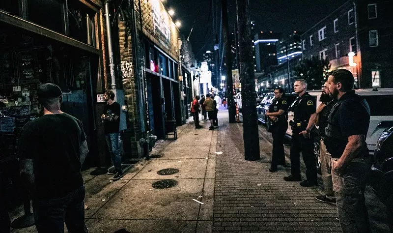 Image: Police stand outside Three Links on Elm Street in this file photo.