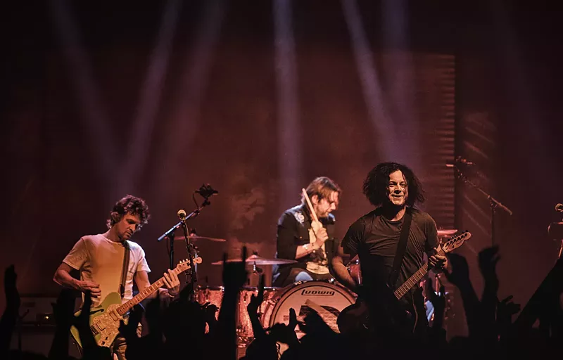 Image: Jack White may try to blend into the band with The Raconteurs, but he still stands out.