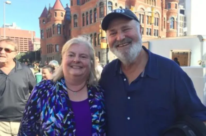Image: Dallas Film Commissioner Janis Burklund, left, poses for a photo with director Rob Reiner while he shoots scenes in downtown Dallas for his 2017 biopic of President Lyndon B. Johnson.
