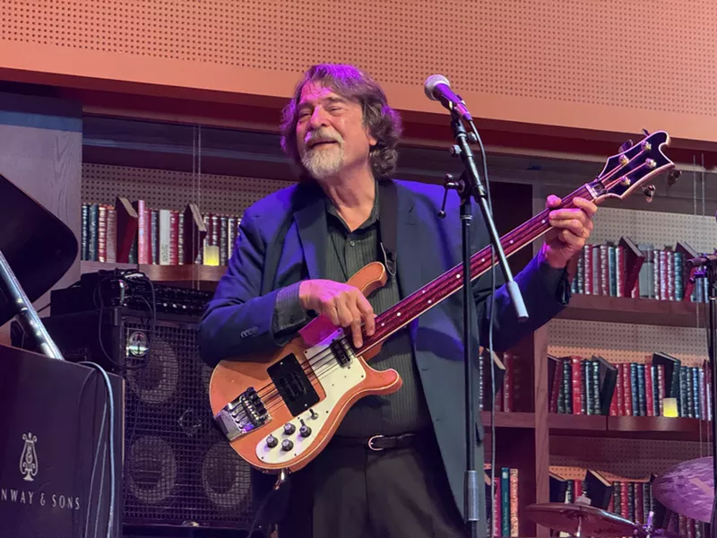Image: Man playing guitar on stage