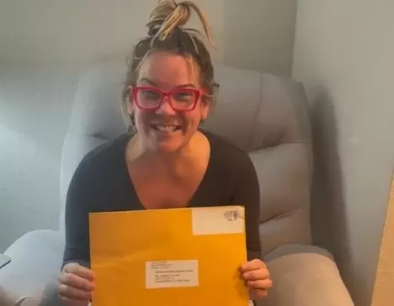 Image: Convicted U.S. Capitol insurrectionist Jenna Ryan shows off the envelope containing her contract for a book deal on her Tiktok page because life is unfair like that sometimes.