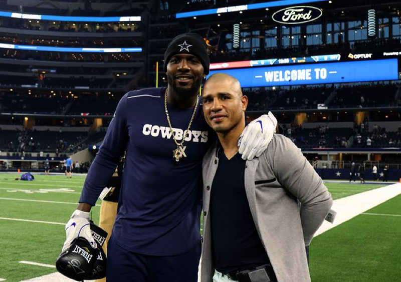Image: Boxer Miguel Cotto presents Cowboy Dez Bryant with a signed boxing glove. Jerry Jones brought Cotto to The Star in February to fight James “Mandingo Warrior” Kirkland.