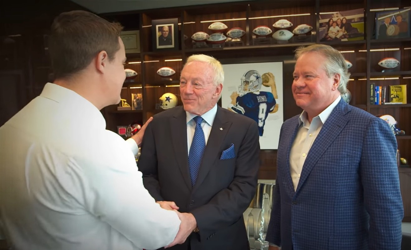 Jason Lake, CEO of the eSports brand compLexity Gaming, shakes hands with Dallas Cowboys owner Jerry Jones and Crescent Real Estate Equities co-founder John Goff.