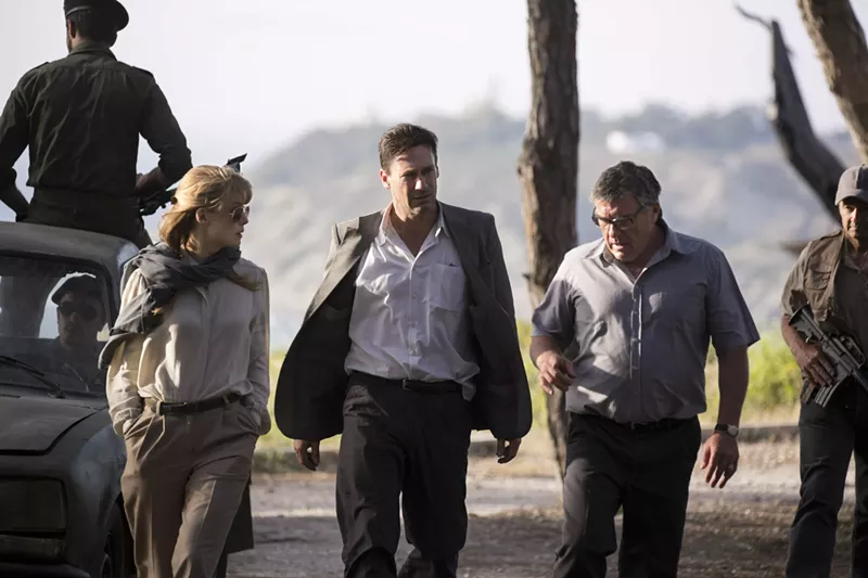 Image: Jon Hamm (middle) plays Mason Skiles, a canny negotiator and poker-faced talker who sees more angles than anyone else does in Brad Anderson’s thriller Beirut, which also stars Rosamund Pike (left).