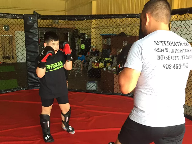 Image: Jose Quinonez in the ring with his son.