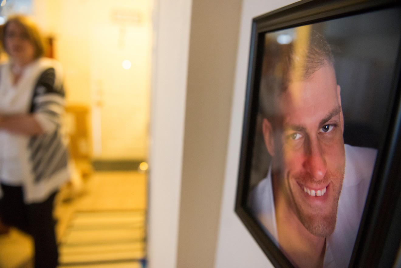 A photo of Joshua Davies hangs on the wall in the home of his mother, Leigh Allison. Davies killed himself despite repeated efforts by his family to get him mental health care.