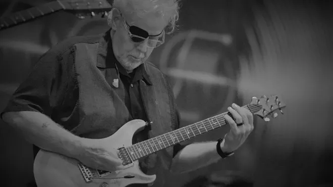 Man playing a guitar