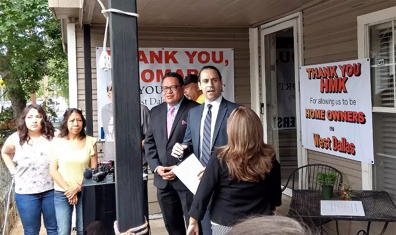 Image: City Council candidate Omar Narvaez (left) and Khraish Khraish announced Monday the planned sale of 130 West Dallas houses to current tenants.