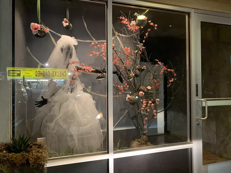 Image: Enter La Viuda Negra (The Black Widow) through a wedding shop façade.