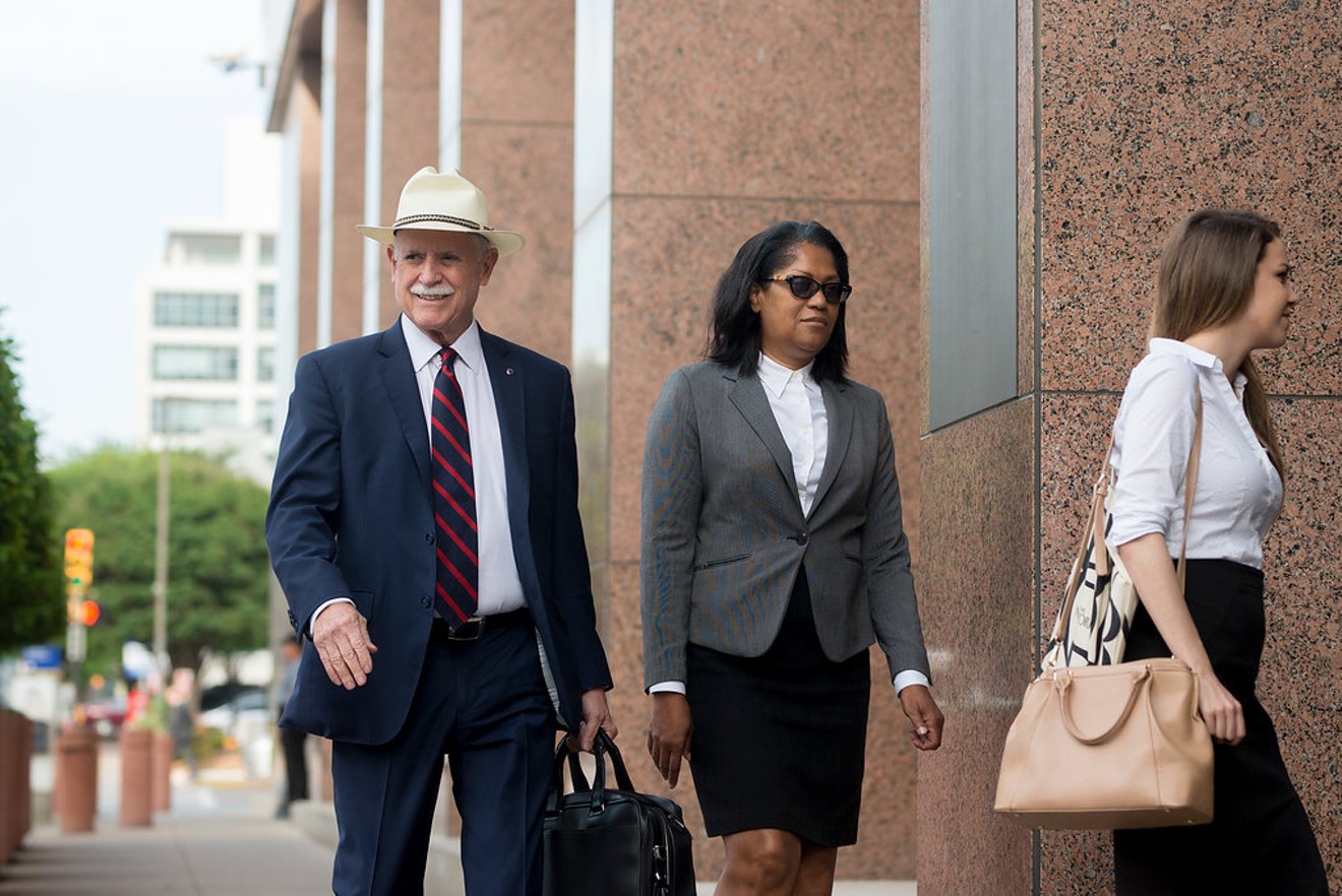 Tom Mills (left) and Dapheny Fain enter the federal courthouse.